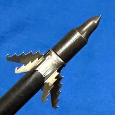 Expandable broadhead hunting arrow tip with serrated blades, metallic silver and black